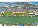 Beautiful aerial view of a waterfront community with sports fields and stunning waterway views at 343 Rex Pl # F, Madeira Beach, FL 33708