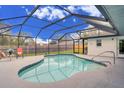 Sparkling screened-in pool with ample deck space, perfect for outdoor relaxation and entertainment at 4553 31St E Ct, Bradenton, FL 34203