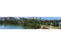 Beautiful aerial view of the waterfront and city skyline with lush greenery and blue skies, perfect for relaxation at 31 Island Way # 303, Clearwater Beach, FL 33767