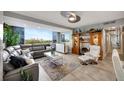 Light, modern living room with large windows, comfortable seating, and stylish decor with a lovely city view at 31 Island Way # 303, Clearwater Beach, FL 33767