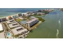 Overhead view of a waterfront condo community that showcases its proximity to the beach, ocean, and various amenities at 19451 Gulf Blvd # 204, Indian Shores, FL 33785