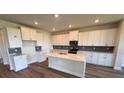 Bright, spacious kitchen features a large island, stainless steel appliances, and white cabinets at 4319 Pullet Ct, Bradenton, FL 34211