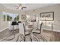Open living area boasts a stylish dining table, counter seating, and bright natural light at 12077 Gandy N Blvd # 344, St Petersburg, FL 33702