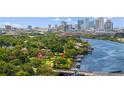 An aerial view shows the property's waterfront location, lush surroundings, and proximity to the downtown area at 2517 N Riverside Dr, Tampa, FL 33602