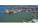 Waterfront home boasts a dock and beautiful views of the tranquil bay area at 16108 5Th E St, Redington Beach, FL 33708