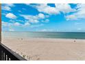 Balcony view of the beautiful pristine white sands of Indian Shores beach and tranquil Gulf waters at 19450 Gulf Blvd # 401, Indian Shores, FL 33785