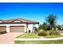 Charming single-story home featuring a tile roof, two-car garage, and well-maintained landscaping at 5426 Rushmere Ct, Palmetto, FL 34221