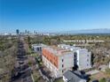 Aerial view of modern townhomes showcasing the community and city skyline in the distance at 2116 4Th S St, St Petersburg, FL 33705