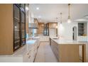 Spacious kitchen with ample counter space, custom cabinets, and sleek, modern finishes at 2622 N Dundee St, Tampa, FL 33629