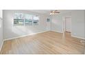 Bright and airy living room featuring hardwood flooring and large windows at 3030 5Th N Ave, St Petersburg, FL 33713