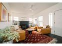 Cozy living room featuring a decorative fireplace, leather furniture, and stylish rug at 4056 18Th S Ave, St Petersburg, FL 33711