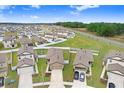 Expansive aerial view of a residential community with manicured lawns and modern homes at 5403 Fez Ct, Brooksville, FL 34602