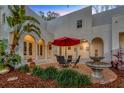 Inviting outdoor patio with charming water feature, perfect for relaxation and entertaining at 4845 W Sunset Blvd, Tampa, FL 33629