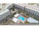 Aerial view of complex with swimming pool, parking, and landscaping at 2506 N Rocky Point Dr # 272, Tampa, FL 33607