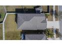 Aerial shot of a well-maintained gray roof with modern shingles, gutters, and ventilation for efficient water runoff at 6834 Blue Moon Way, Sun City Center, FL 33573