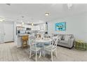 Light and airy open floor plan featuring modern finishes, wood floors, dining area, and comfortable living space at 6950 113Th St, Seminole, FL 33772