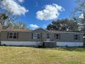 Charming single-story home with a cozy front porch and well-maintained lawn at 12914 Gordon Rd, Riverview, FL 33579