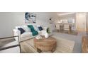 Open-concept living and dining area with stylish furniture and decor at 1311 Powderpuff Dr # 4, Dunedin, FL 34698