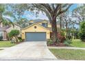 Inviting two-story home with a spacious driveway and well-maintained front yard at 5608 Rockfield Loop, Valrico, FL 33596