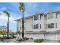 Inviting condo complex with garages and well-maintained landscaping at 9341 Blind Pass Rd, St Pete Beach, FL 33706