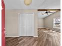 Inviting foyer features wood-look tile flooring, a ceiling fan, and a bright, neutral color palette at 11001 Hobson St, Spring Hill, FL 34608