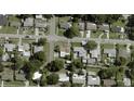Aerial view of the property showcasing its location in a residential neighborhood with nearby streets and surrounding homes at 3916 W Oklahoma Ave, Tampa, FL 33616