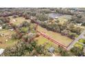 Expansive acreage with tree coverage, outlined to show property boundaries at 3009 Jim Johnson Rd, Plant City, FL 33566