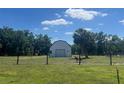 Well maintained barn in fenced pasture with donkeys grazing at 3009 Jim Johnson Rd, Plant City, FL 33566