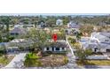 An overhead view of a home nestled in a residential neighborhood with mature trees at 431 Rafael Ne Blvd, St Petersburg, FL 33704