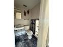 Bathroom with damaged walls and floors showcasing the need for renovation at 14236 Palm St, Madeira Beach, FL 33708