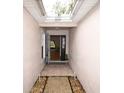 Inviting entryway with tiled floors and a view into the home's interior at 35324 Whispering Pines Dr, Zephyrhills, FL 33541