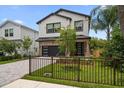 Charming two-story home with manicured lawn and complementary landscaping at 1046 Bass Blvd, Dunedin, FL 34698