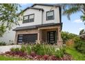 Stunning two-story home with lush, manicured landscaping at 1046 Bass Blvd, Dunedin, FL 34698