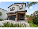 Beautiful two-story home with lush, manicured landscaping at 1046 Bass Blvd, Dunedin, FL 34698