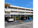 Assigned covered parking spot for unit 203 offers elevator and stair access to floors above at 4920 Locust Ne St # 203, St Petersburg, FL 33703