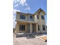 New two-story home featuring black window trim and a light beige exterior at 3640 15Th N St, St Petersburg, FL 33704