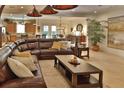 Inviting living room features a large sectional sofa, neutral tones, and open floor plan at 3222 W Empedrado St, Tampa, FL 33629