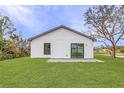 A lovely, expansive backyard featuring a manicured lawn and a charming patio at 3418 Eagle Pass St, North Port, FL 34286