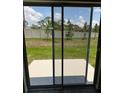 Backyard featuring a patio space and green grass at 4652 Pleasant Ave, Palm Harbor, FL 34683