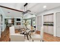 Cozy dining area next to the fireplace with a view of the backyard and pool at 5101 Oakhaven Ln, Temple Terrace, FL 33617