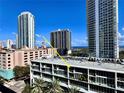 Beautiful building with many windows and balconies, framed by swaying palm trees and other high-rise buildings at 145 2Nd S Ave # 616, St Petersburg, FL 33701