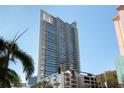 Modern building with glass exterior, balconies, and nearby trees at 145 2Nd S Ave # 616, St Petersburg, FL 33701