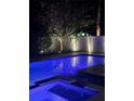 Inviting swimming pool illuminated at night creating a serene and relaxing atmosphere at 4224 W Kensington Ave, Tampa, FL 33629