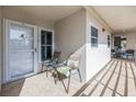 Cozy condo patio featuring tile floor, two chairs and small table for relaxing outdoors at 6093 Bahia Del Mar Cir # 375, St Petersburg, FL 33715