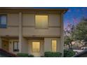 Townhome exterior with warm lighting, complemented by manicured landscaping and a tranquil neighborhood setting at 1470 Highland Ridge Cir, Brandon, FL 33510