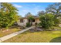 Charming single-story home with landscaped front yard and a stone pathway leading to the entrance at 1110 W Coral St, Tampa, FL 33602