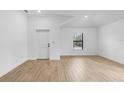 Spacious living room with tile floors, natural light, and neutral walls at 3355 Moncrief Ave, North Port, FL 34286