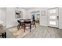 Open-concept dining area with modern lighting and stylish decor at 4210 Harrisburg Ne St, St Petersburg, FL 33703
