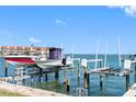 Boats on a private boat lift offer convenient waterfront access and a day on the water at 363 Pinellas Bayway S # 41, St Petersburg, FL 33715