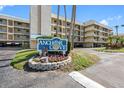 Entrance to Anchor Cove, a well-maintained community with lush landscaping and a welcoming atmosphere at 363 Pinellas Bayway S # 41, Tierra Verde, FL 33715